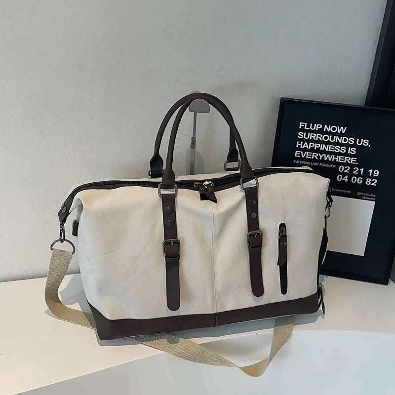 Sac polochon de voyage homme en toile noir et marron avec bandoulière