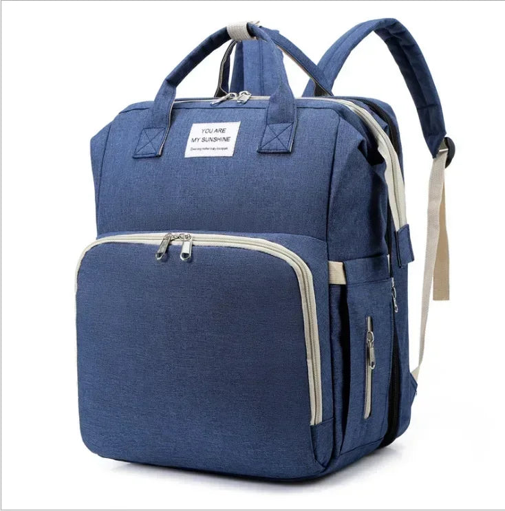 Sac à langer convertible en lit pliable avec 3 emplacements biberons