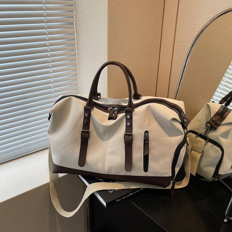Sac polochon de voyage homme en toile noir et marron avec bandoulière