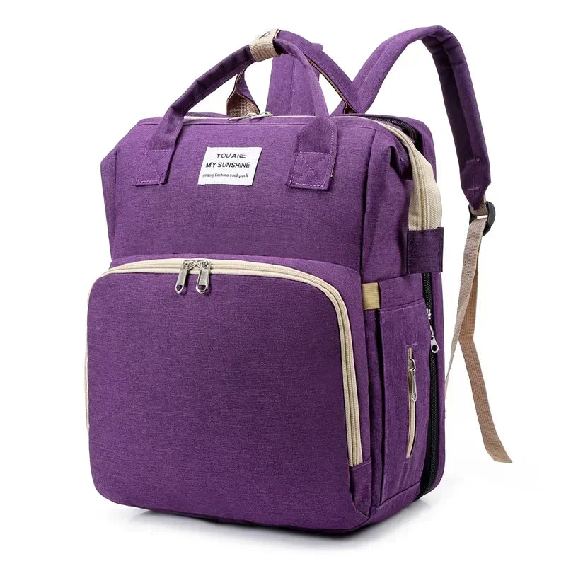 Sac à langer convertible en lit pliable avec 3 emplacements biberons