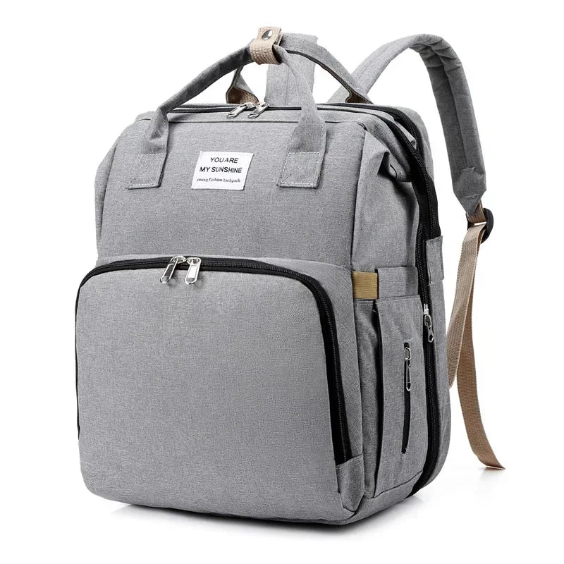 Sac à langer convertible en lit pliable avec 3 emplacements biberons