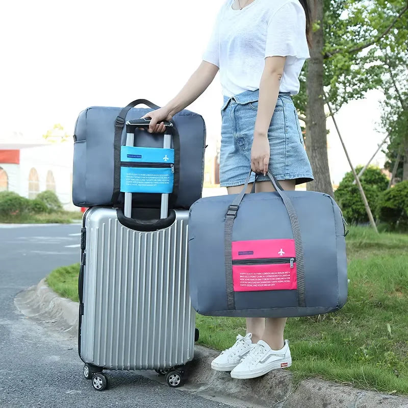 Sac polochon de voyage pliable imperméable gris avec sangle pour valise