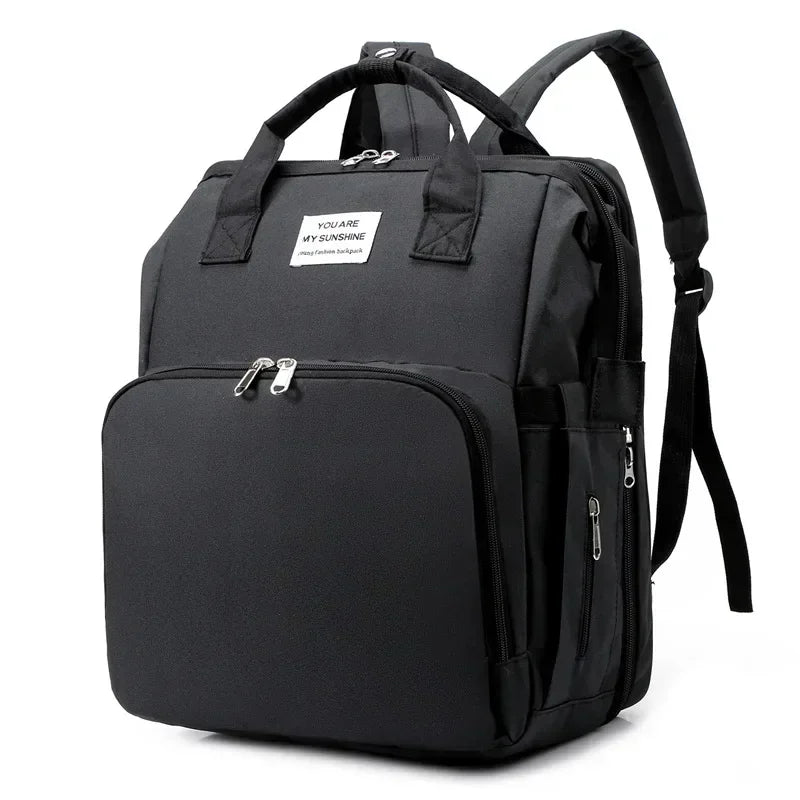 Sac à langer convertible en lit pliable avec 3 emplacements biberons