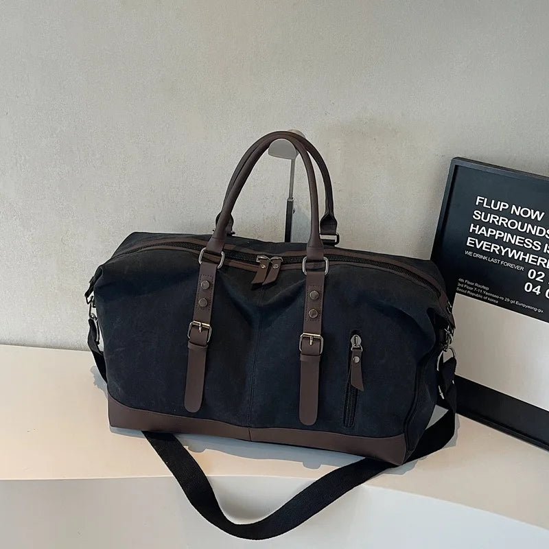 Sac polochon de voyage homme en toile noir et marron avec bandoulière